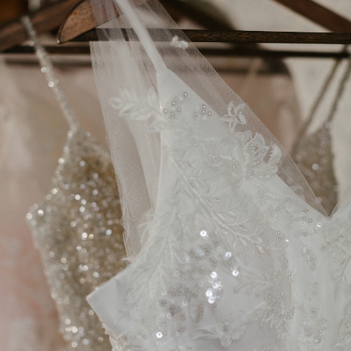 Sparkly wedding dresses with beaded details and soft veils at Monica’s Bridal Boutique in Lakewood Ranch