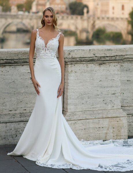 Elegant lace wedding gown with fitted silhouette at Monica’s Bridal Boutique Sarasota