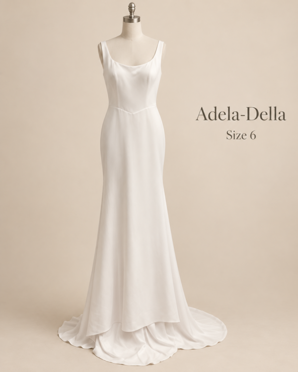 Front mannequin view of Adela-Della size 6 minimalist ivory satin wedding dress with scoop neckline and fitted silhouette
