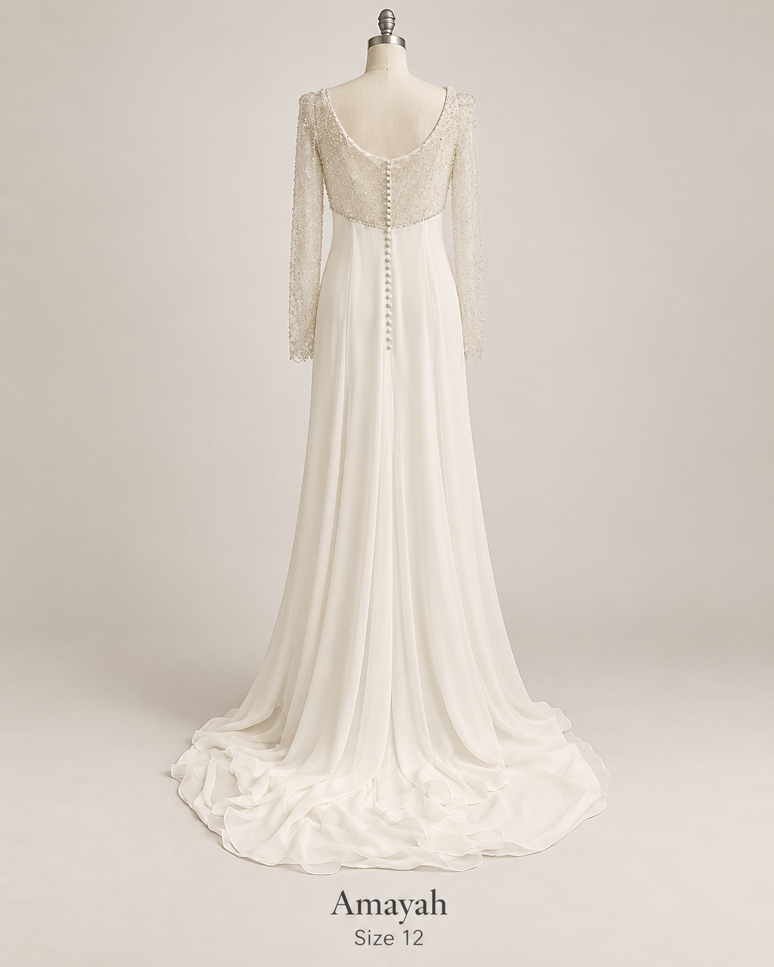 Back mannequin view of Amayah size 12 ivory wedding dress with beaded long sleeves, scoop back and covered buttons