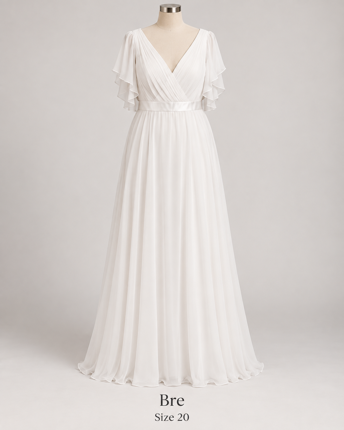Front view of Bre size 20 wedding gown with pleated V-neck bodice, flutter sleeves and flowing chiffon skirt