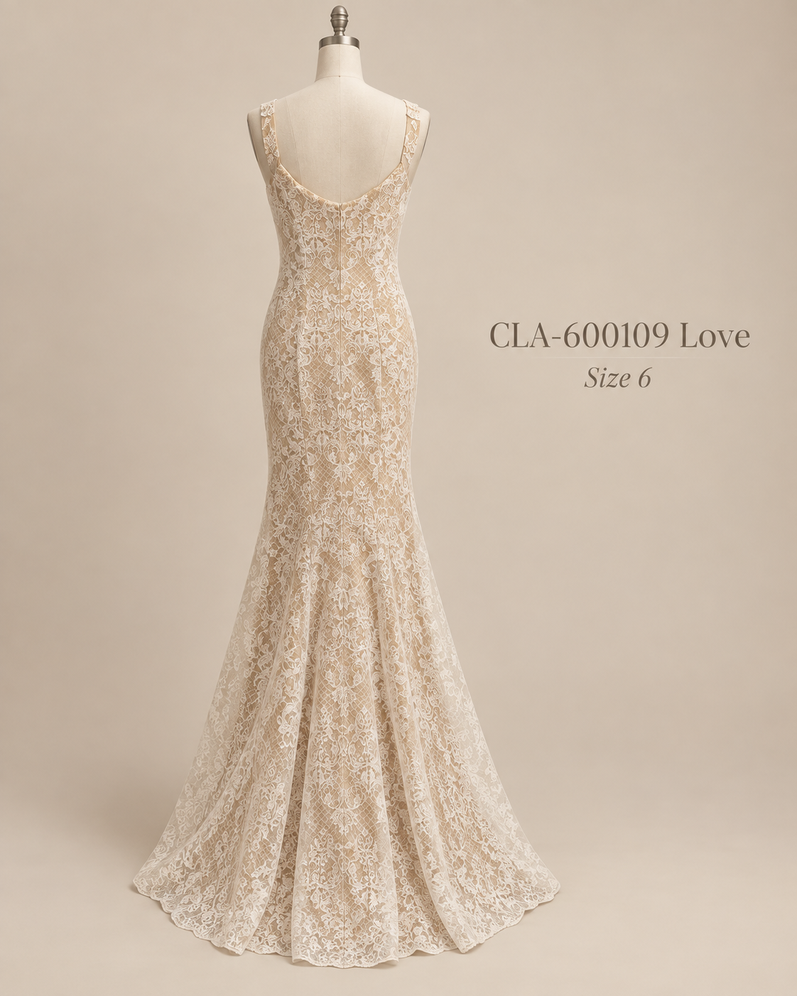 Back mannequin view of Camila size 6 lace wedding gown with low scoop back and fitted silhouette