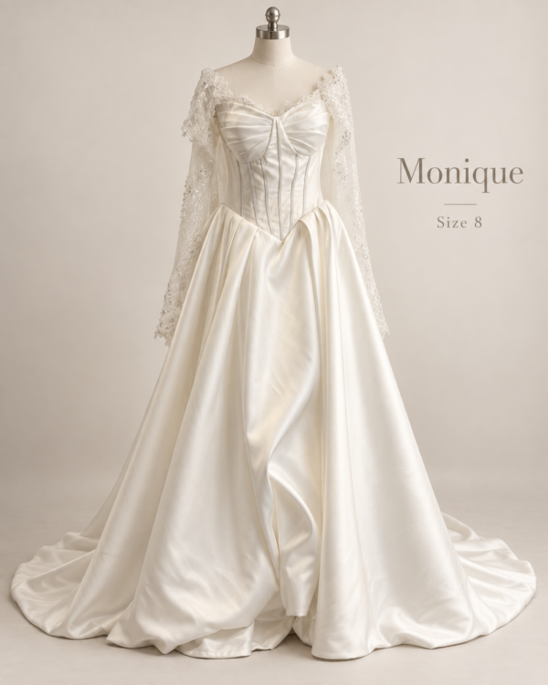 Front mannequin view of Monique size 8 ivory satin ball gown with corset bodice, pointed waist and lace cape sleeves